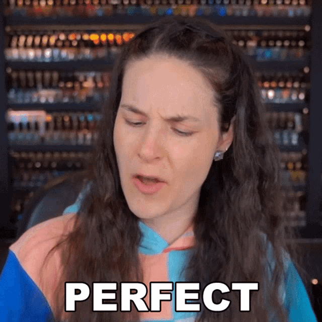 a woman is making a funny face and the word perfect is on the screen