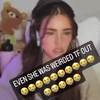 a woman wearing headphones has a sign that says " even she was weirded tf out "