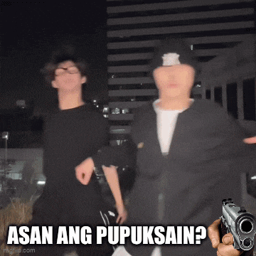 a man holding a gun with the words asan ang pupuksain behind him