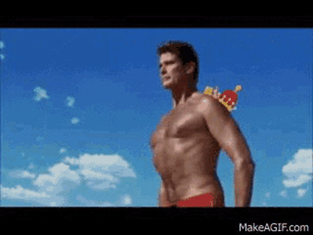 a shirtless man with a crown on his shoulder is standing in front of a blue sky