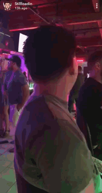 a man 's face is shown in a stillloadin video