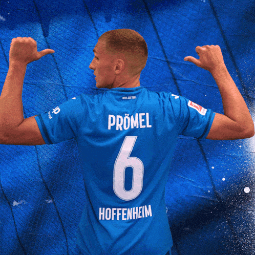 a man in a blue jersey with the number 6 on the back