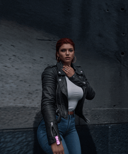 a woman with red hair wearing a leather jacket and jeans