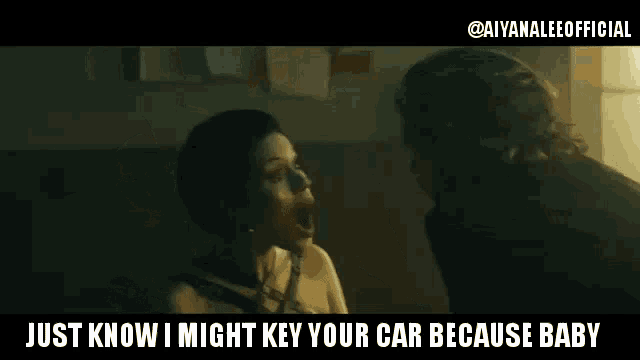 a man is holding a key to a woman 's car in a dark room .