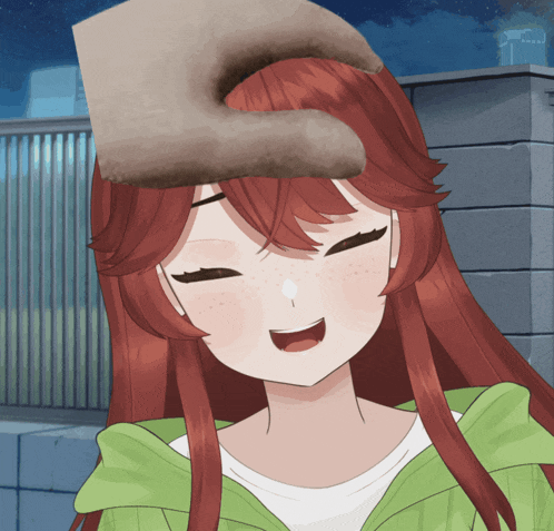 a girl with red hair and freckles is smiling and a hand is putting something on her head