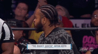 a wrestler named bryan keith is sitting in the ring