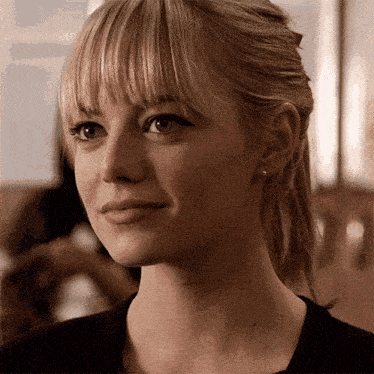 a close up of a woman 's face with blonde hair
