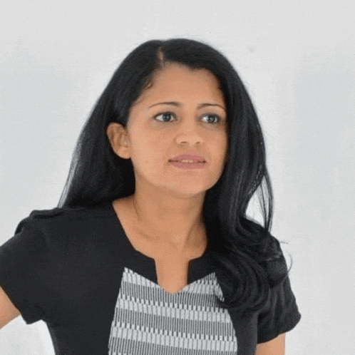a woman with long black hair is wearing a black top