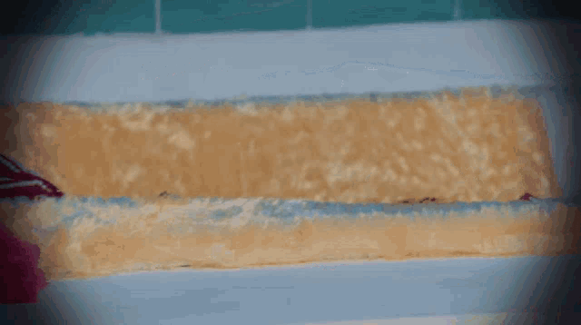 a woman is laying in a bathtub with foam on the walls
