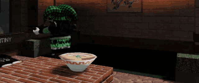 a bowl of soup is sitting on a brick table
