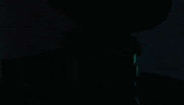 a blurred image of a person 's face with a blue background