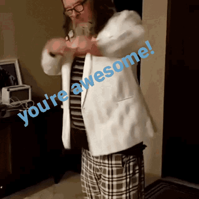 a man in a white jacket with the words you 're awesome