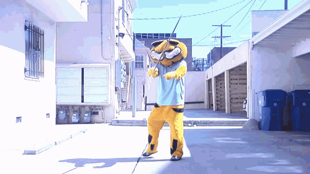 a person in a mascot costume holding a fishing rod