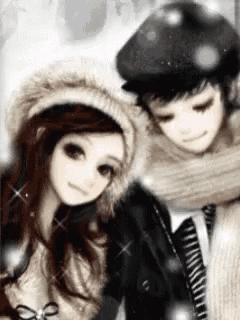 a boy and a girl are standing next to each other in the snow .