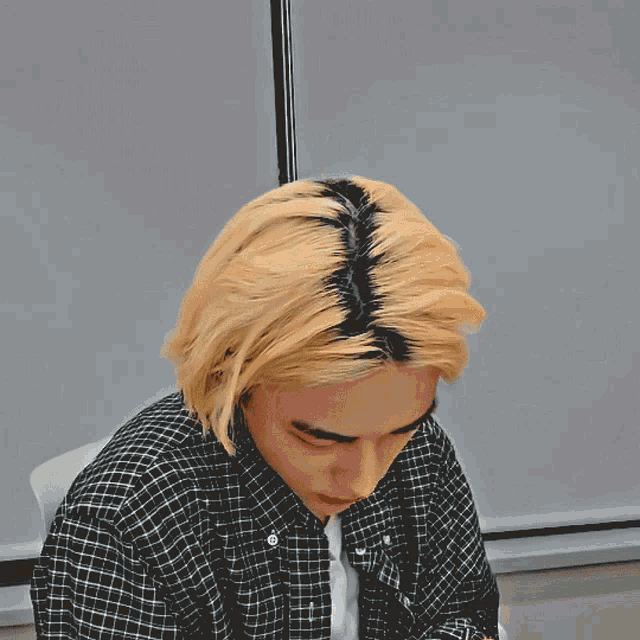 a man with a plaid shirt has wtf written on his face