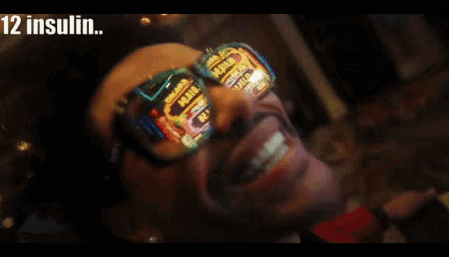 a man wearing sunglasses with the words 12 insulin 13 insulin and warrenton blasttt on the bottom