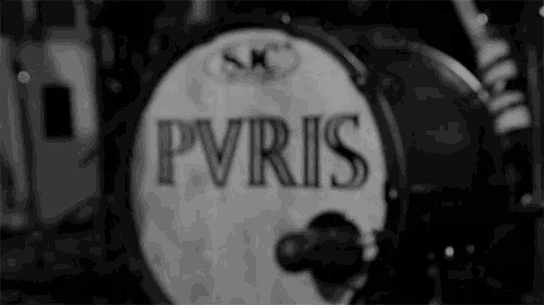 a black and white photo of a drum with the word pyris on it