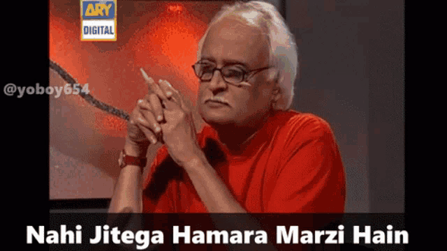 a man wearing glasses and a red shirt with the words nahi jitega hamara marzi hain