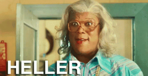 a man in a wig and glasses is standing in front of a door and the word heller is on the bottom