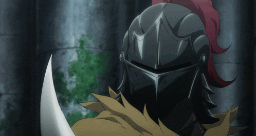a close up of a knight 's helmet with red hair