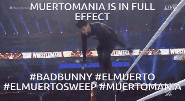 a man in a black shirt is jumping over a rope with the words " muertomania is in full effect " above him