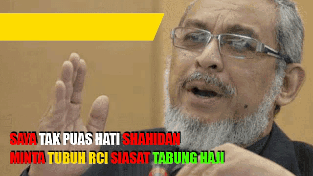 a man with glasses and a beard says " saya tak puas hati shahidan "