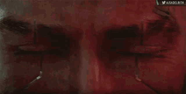 a close up of a man 's eyes with aisadelrith written below