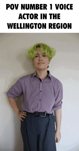 a person with green hair is standing in front of a sign that says pov number 1 voice actor in the wellington region .