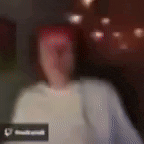 a blurry picture of a person 's face with a heart icon in the corner .