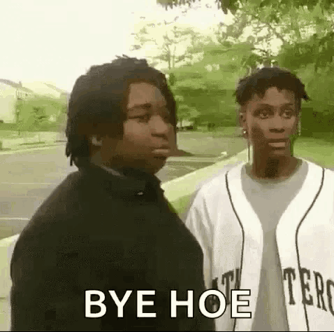 two men are standing next to each other on a sidewalk and one of them is saying bye hoe .