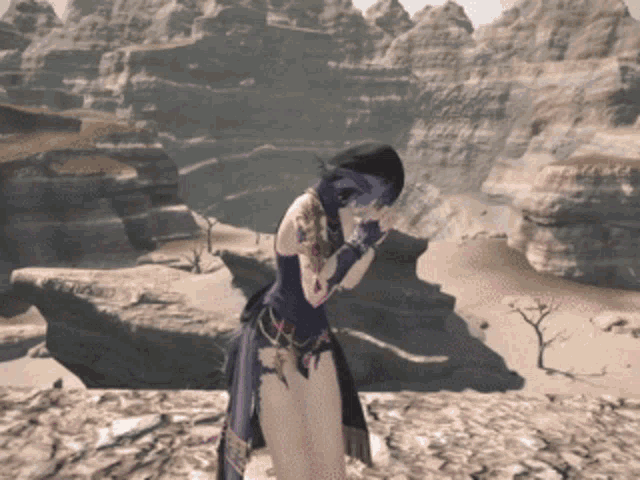a woman in a blue dress is standing in a desert landscape