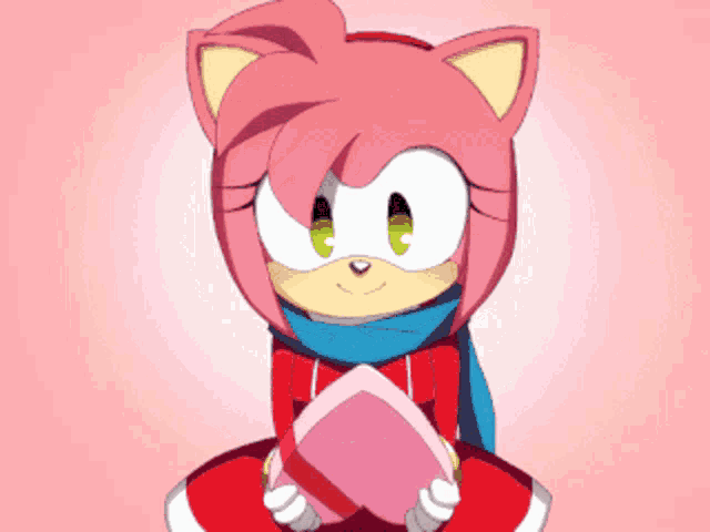 amy rose from sonic the hedgehog is holding a pink heart in her hands