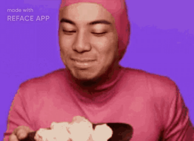 a man in a pink suit is smiling with the words made with reface app below him
