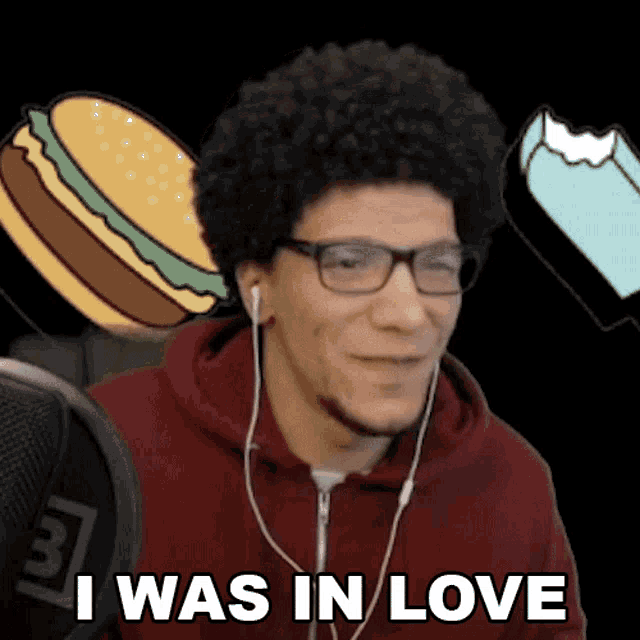 a man wearing headphones says " i was in love " in front of a hamburger and ice cream