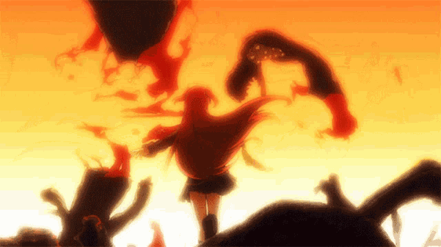 a girl with long red hair is standing in front of a burning tree