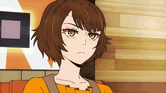 a girl with brown hair and orange eyes looks angry