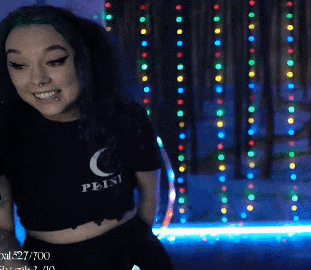 a woman wearing a crop top that says peini on it