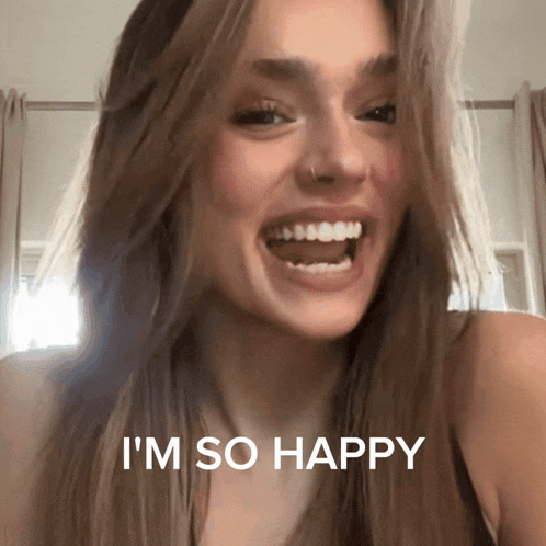 a woman says i 'm so happy while smiling