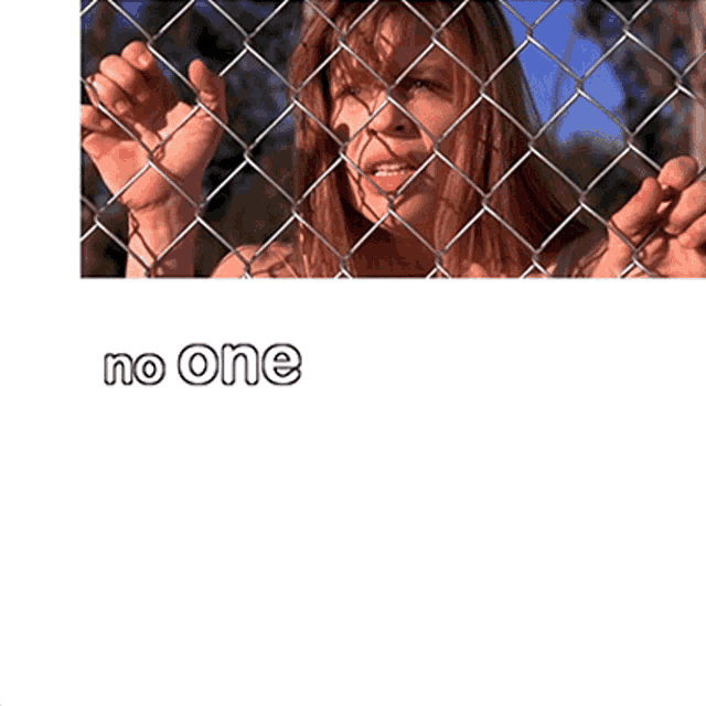 a woman behind a chain link fence with the words " no one saw the fuckin danger " below her