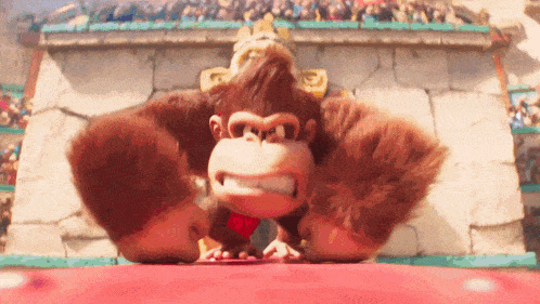 a cartoon gorilla with a crown on his head is standing on a red carpet