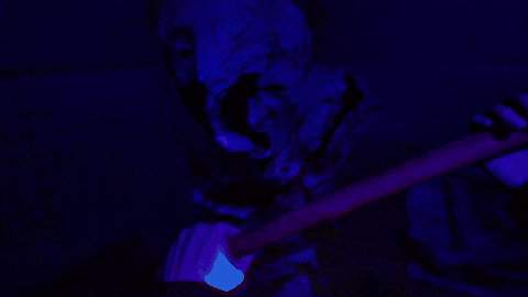 a person is holding a glow in the dark object in their hand