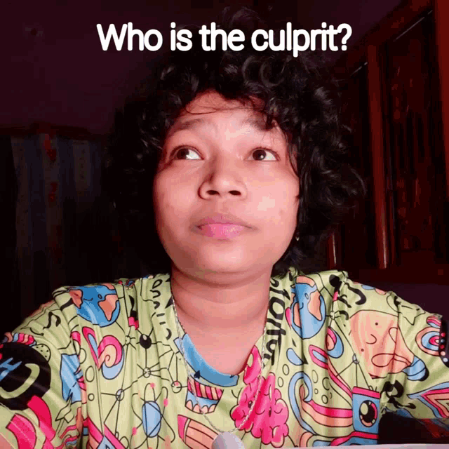 a woman with curly hair is wearing a green shirt that says " who is the culprit " on it