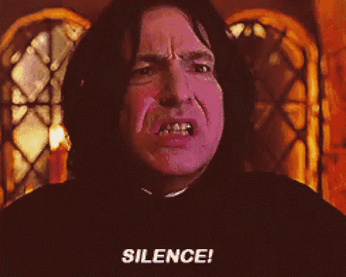 a close up of a man 's face with the words silence written below it