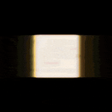 a blurred image of a square with a circle in the middle on a black background