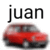 a blurry picture of a red car with the name juan on it