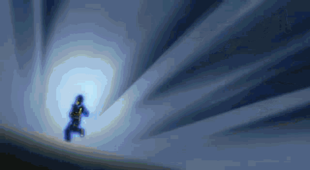 a person is running through a tunnel with a light coming out of the end