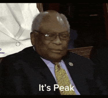 a man in a suit and tie with the words it 's peak above him