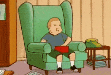 a cartoon character is sitting in a green chair with a red box in his hand