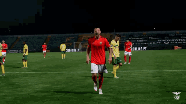 a soccer player in a red shirt with the number 1 on it