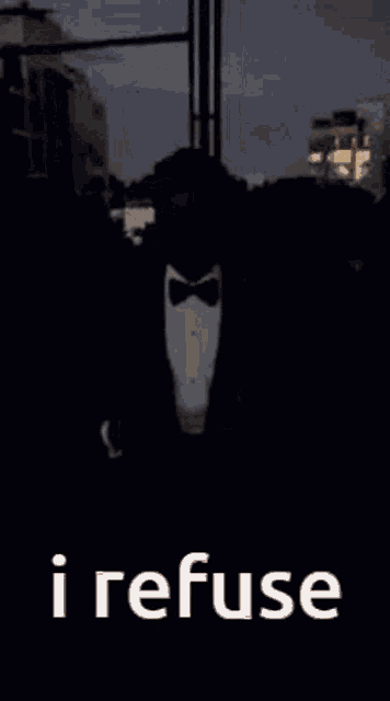 a man in a tuxedo with the words i refuse in white letters